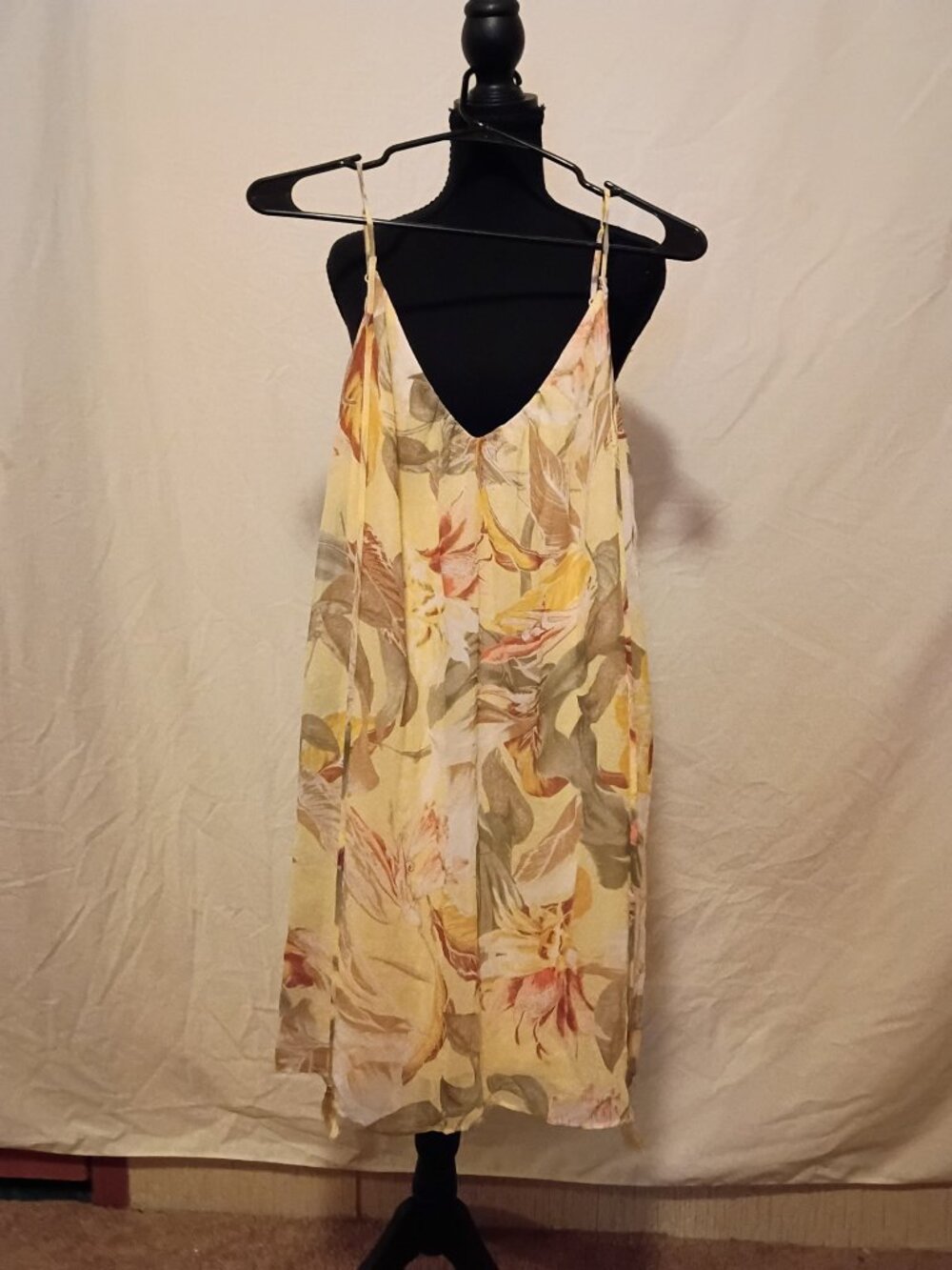 Soft yellow floral print spaghetti strap dress.